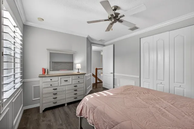 a room with furniture a chandelier and a window