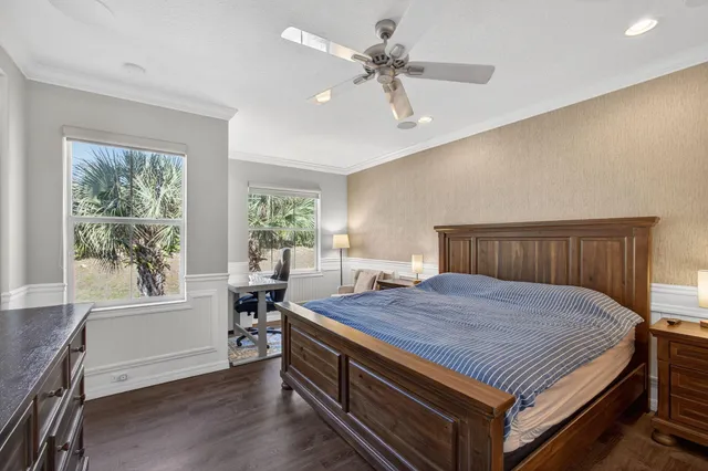 a bathroom with a granite countertop bathtub a double vanity sink and a mirror