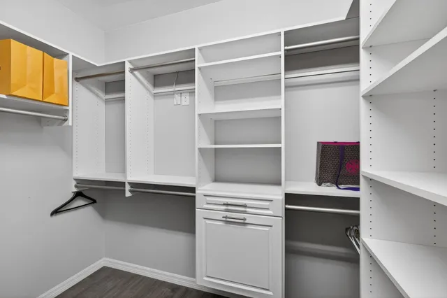 a front view of a house with a yard and a garage