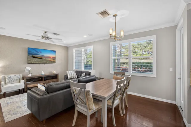 a view of kitchen dining table and chairs