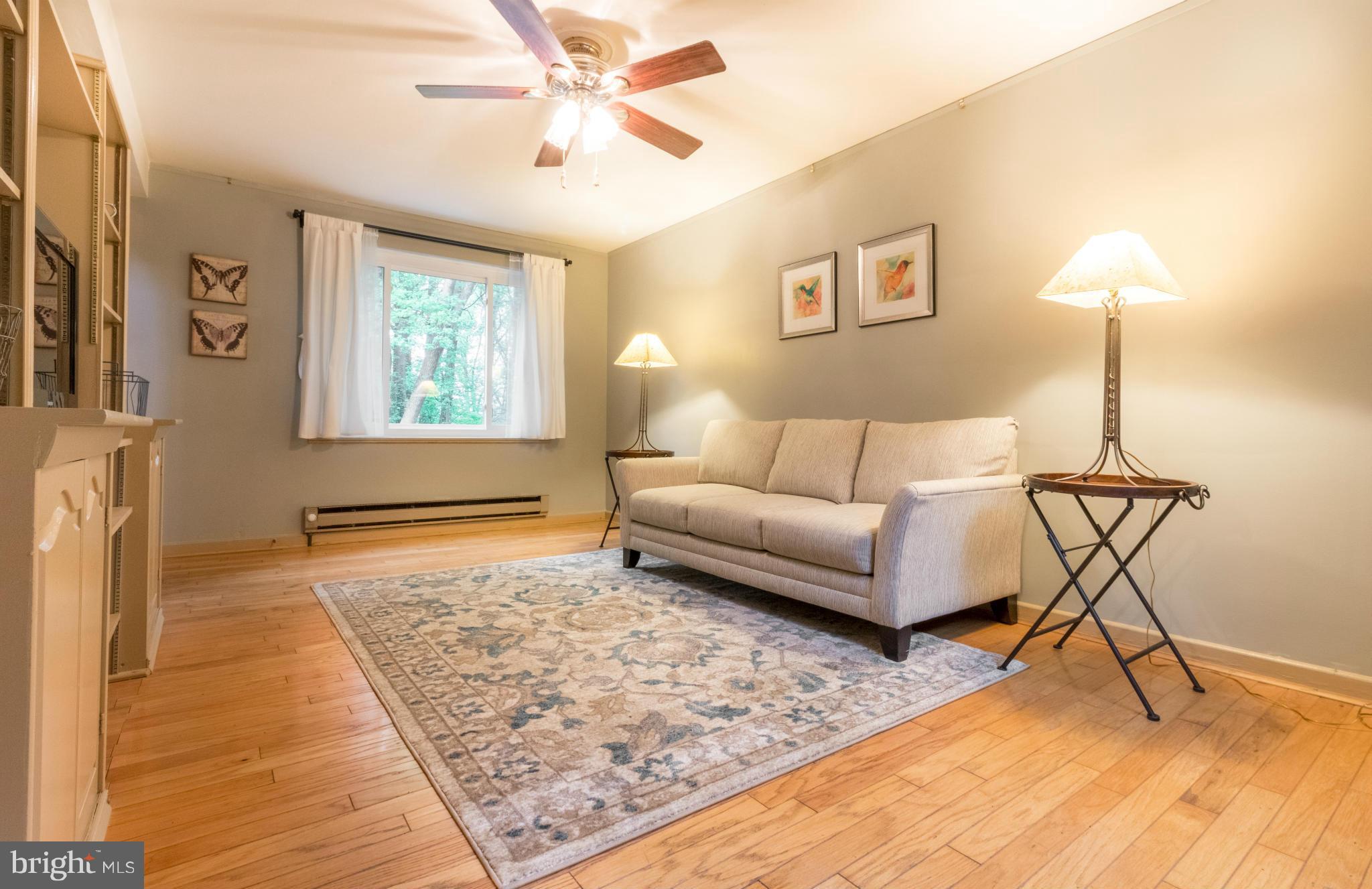 3 Crescent Road, Unit B Greenbelt, MD 20770 - Photo 2 of 22 a living room with furniture and a rug