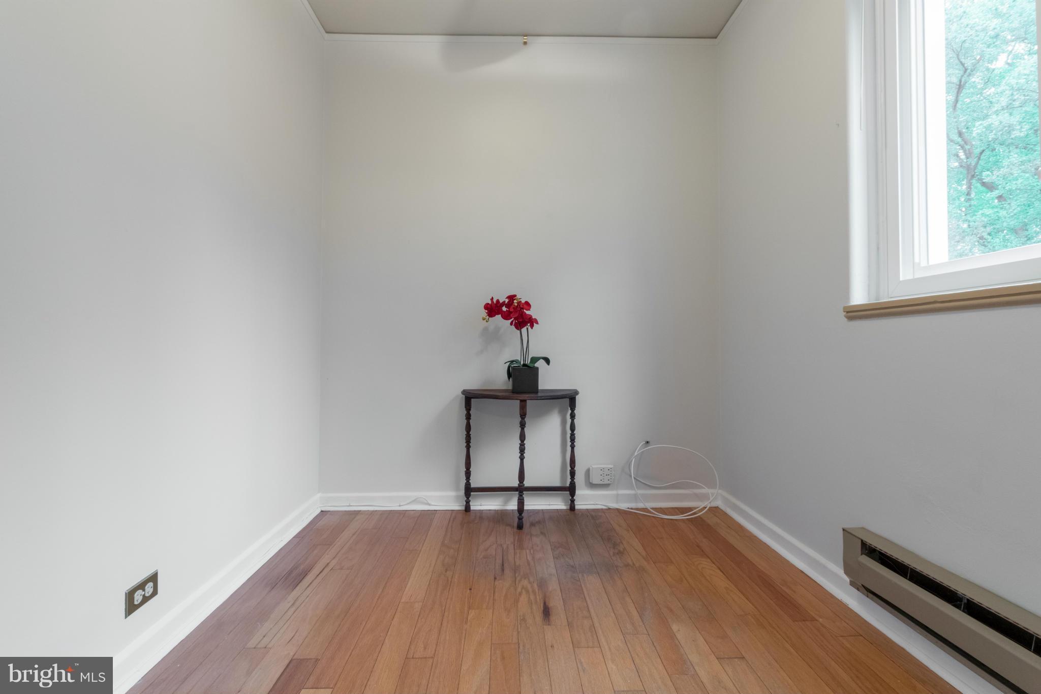 3 Crescent Road, Unit B Greenbelt, MD 20770 - Photo 12 of 22 a view of a room with wooden floor and window