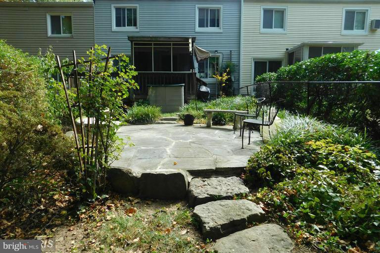 3 Crescent Road, Unit B Greenbelt, MD 20770 - Photo 19 of 22 front view of a house with a garden