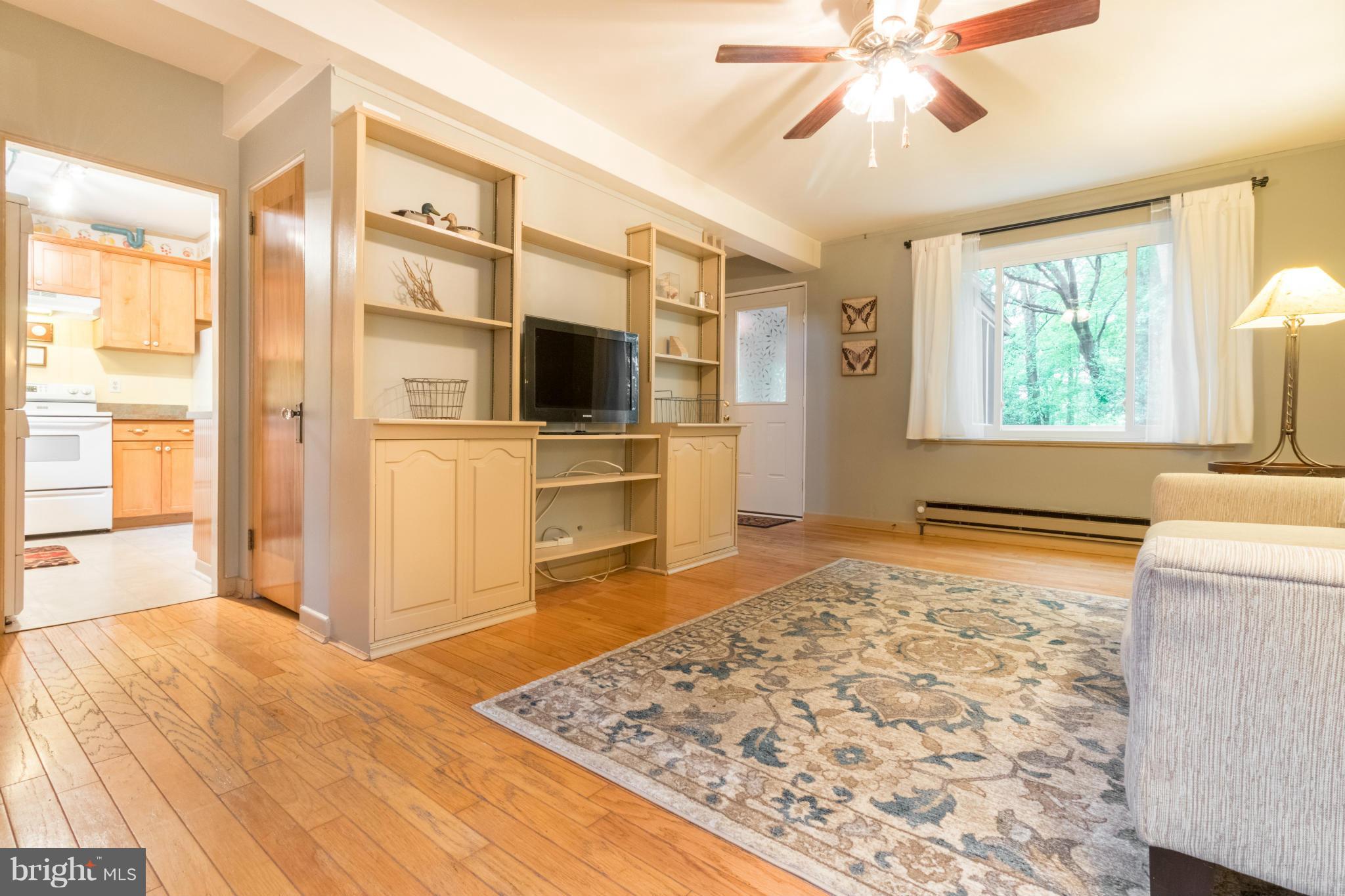 3 Crescent Road, Unit B Greenbelt, MD 20770 - Photo 3 of 22 a bedroom with a bed and a flat screen tv