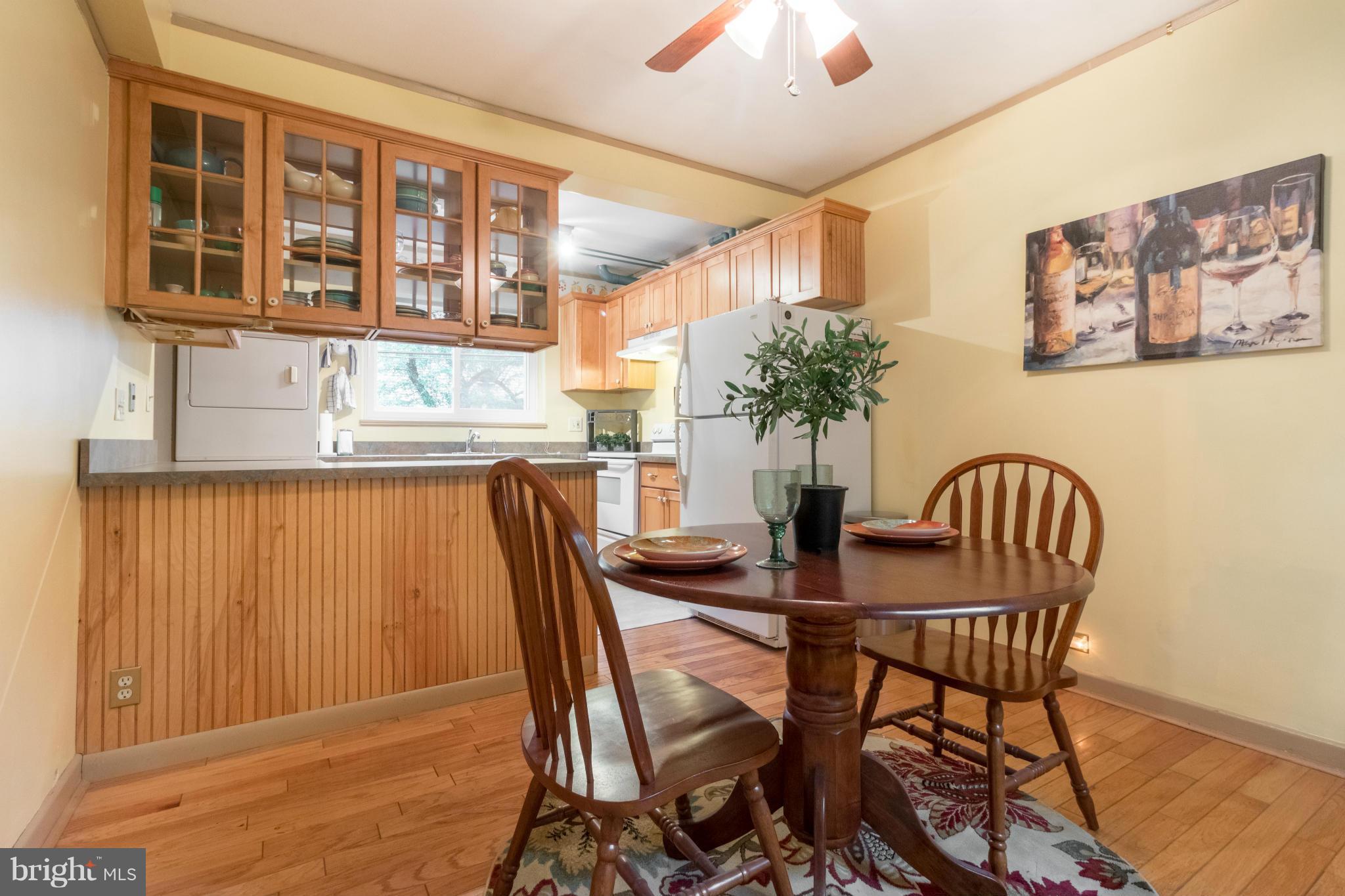 3 Crescent Road, Unit B Greenbelt, MD 20770 - Photo 5 of 22 a view of a dining room with furniture and chandelier