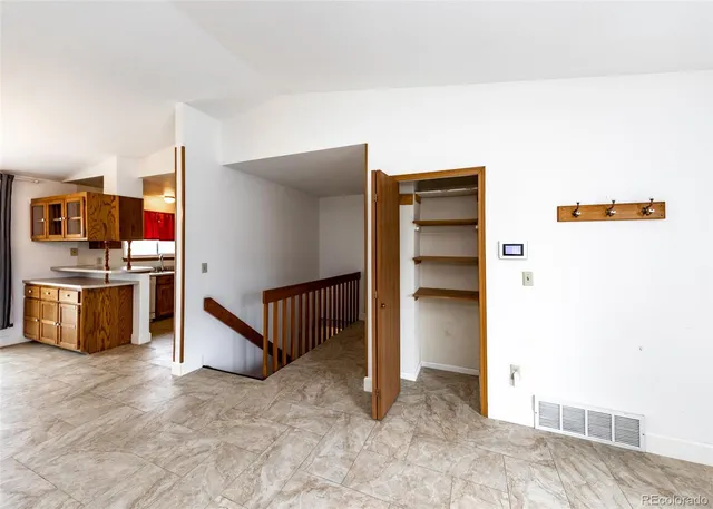 a view of kitchen with cabinets