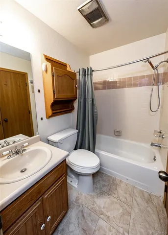 a bathroom with a sink a toilet and a bathtub