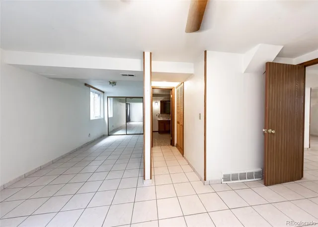 a kitchen with a refrigerator and a sink