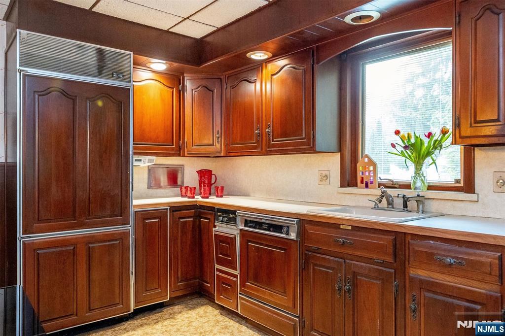 66 Coeyman Avenue Bloomfield, NJ 07003 - Photo 5 of 29 a kitchen with a sink and a refrigerator