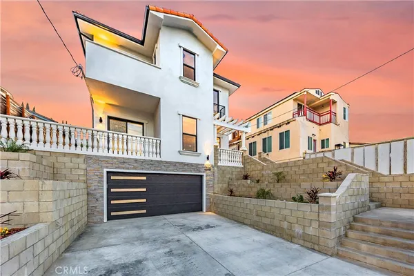 a front view of a house with a garage