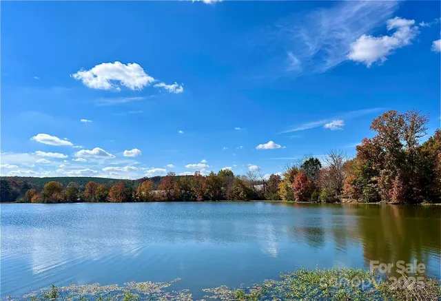 a view of a lake with sunset view