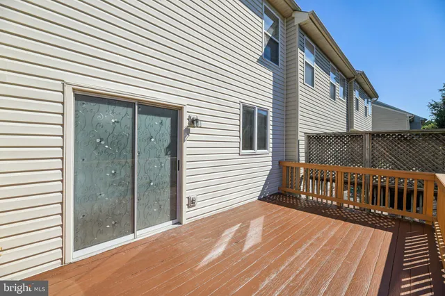 a view of a house with wooden deck