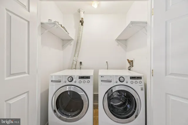 a utility room with dryer and washer