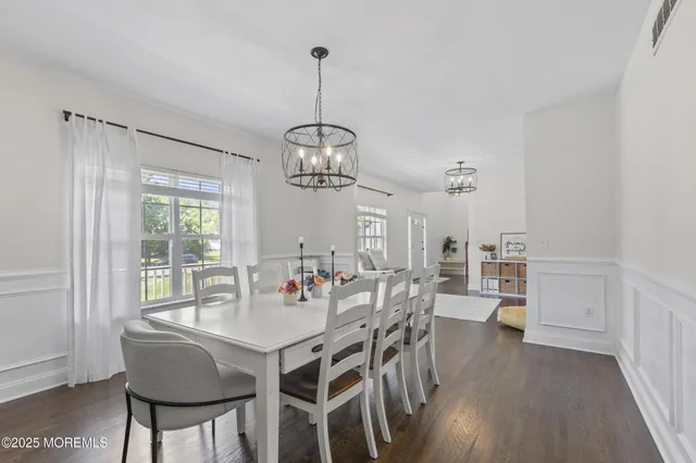 a kitchen with refrigerator cabinets and wooden floor
