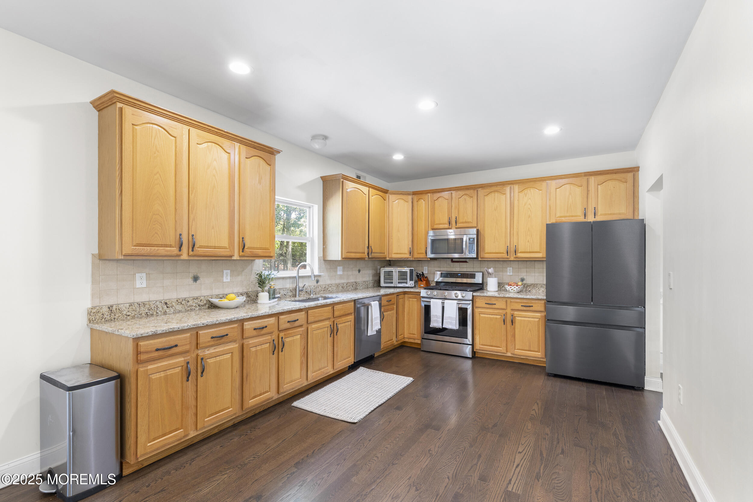 6 Kindling Way Jackson, NJ 08527 - Photo 14 of 54 a kitchen with refrigerator cabinets and wooden floor
