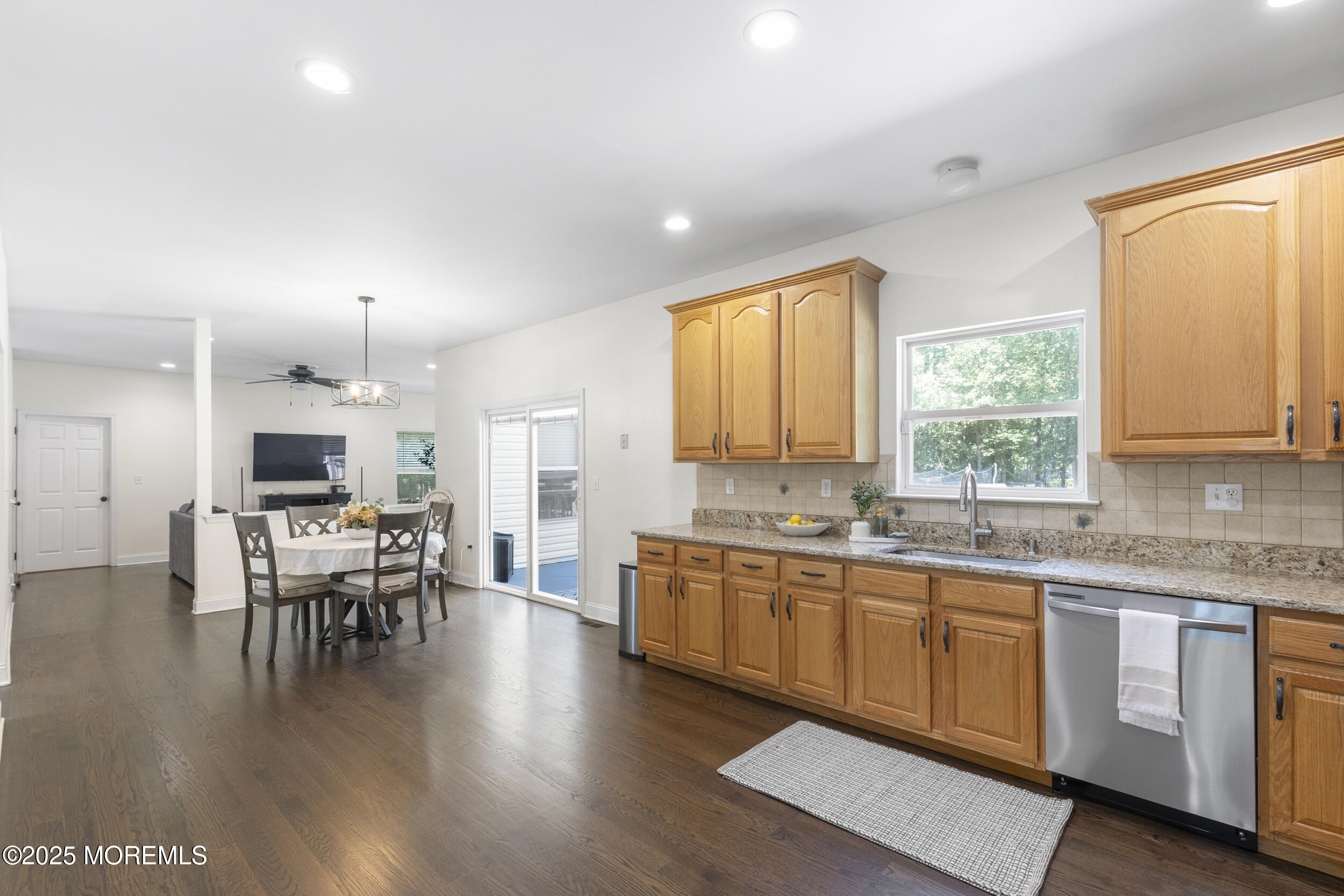 6 Kindling Way Jackson, NJ 08527 - Photo 15 of 54 a large white kitchen with lots of counter space and dining table