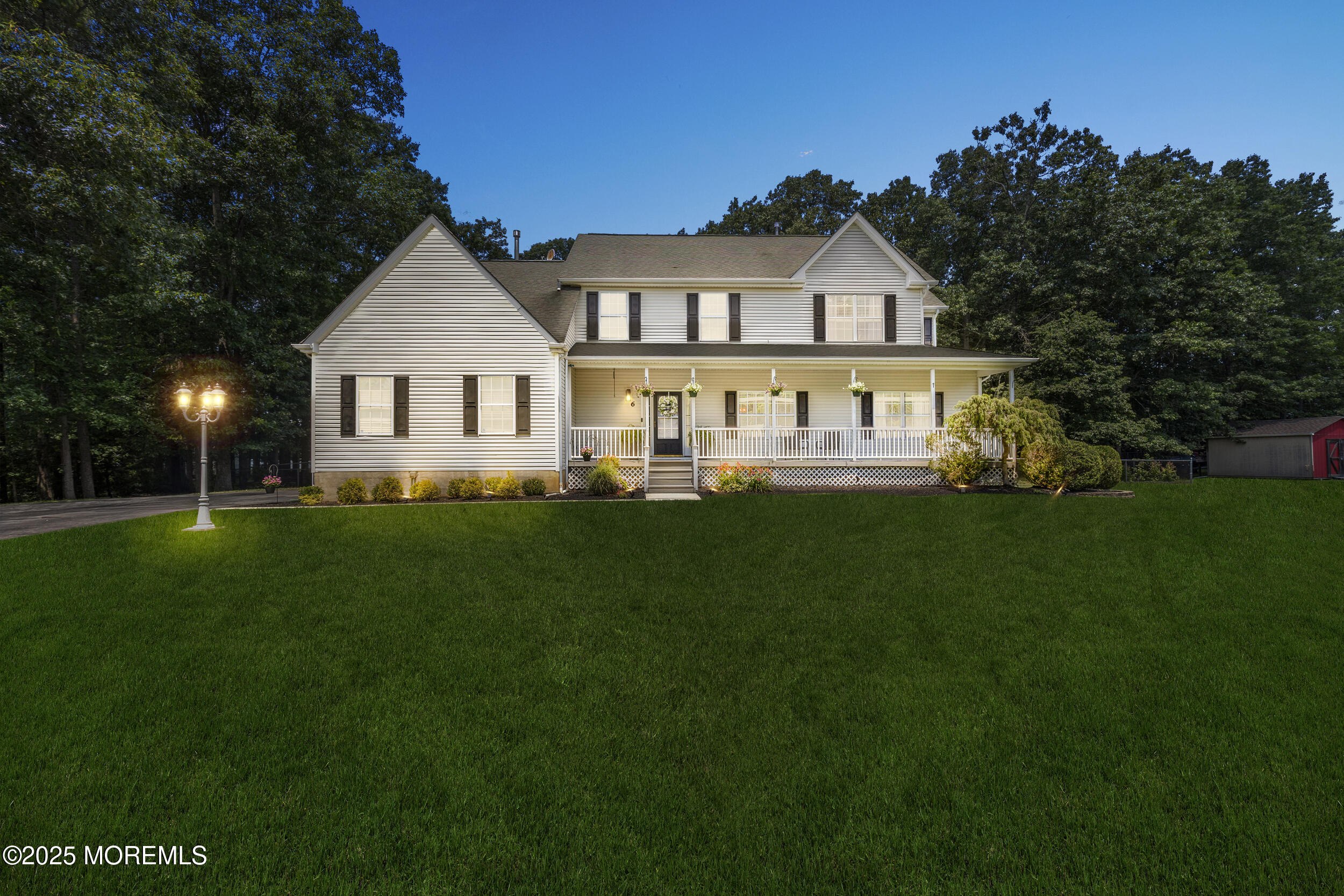 6 Kindling Way Jackson, NJ 08527 - Photo 2 of 54 a front view of a house with a yard and trees