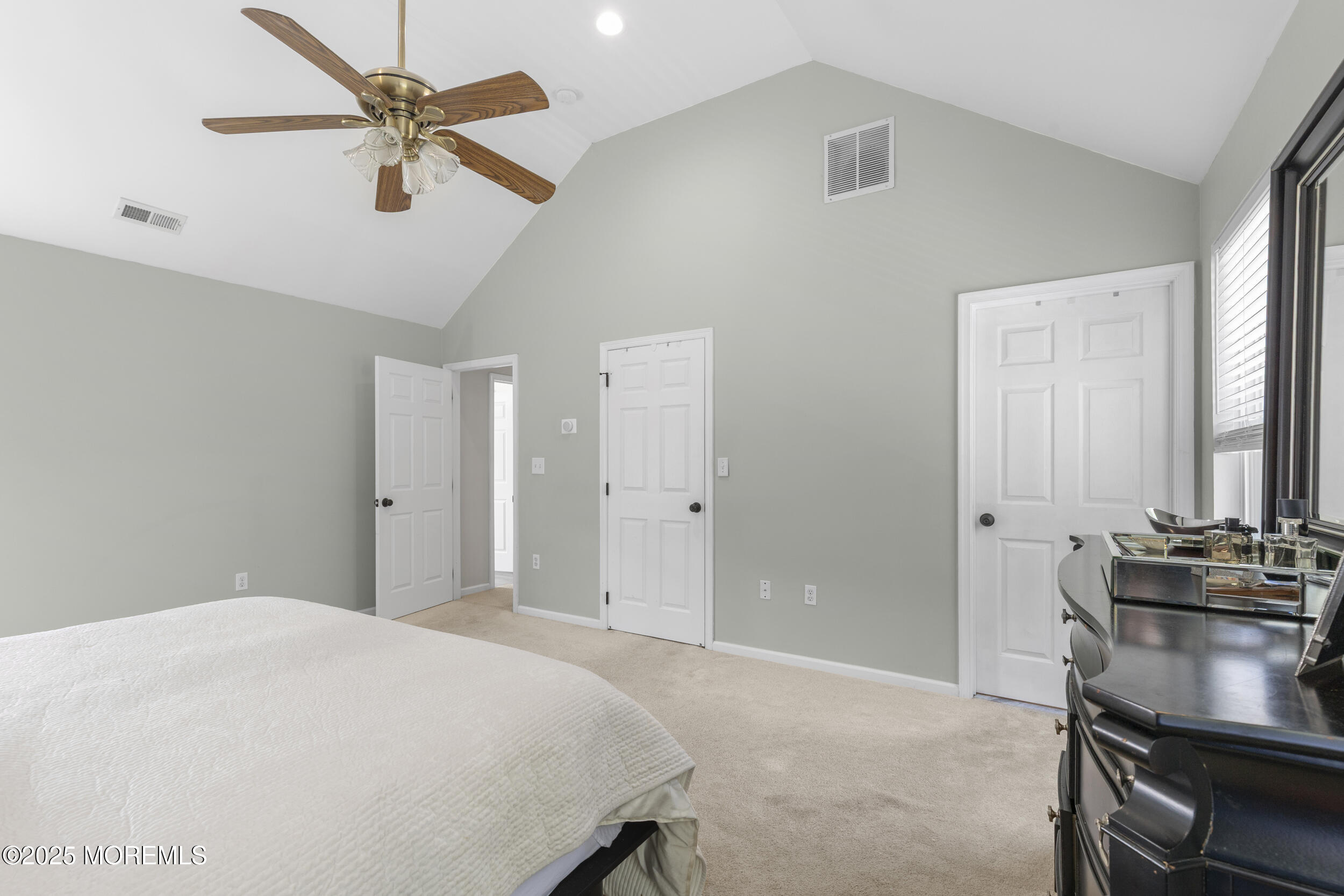 6 Kindling Way Jackson, NJ 08527 - Photo 29 of 54 a bedroom with a bed and a chandelier
