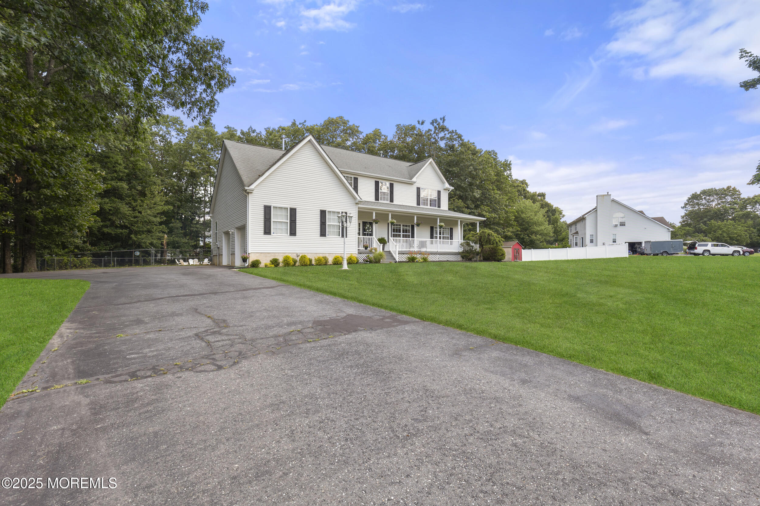 6 Kindling Way Jackson, NJ 08527 - Photo 3 of 54 a view of a house with a big yard and large trees