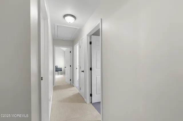 a bathroom with a granite countertop toilet sink and mirror