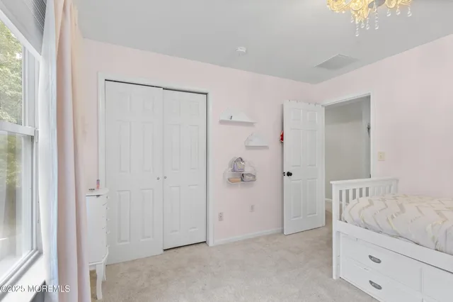 a view of a chair and table on the wooden floor