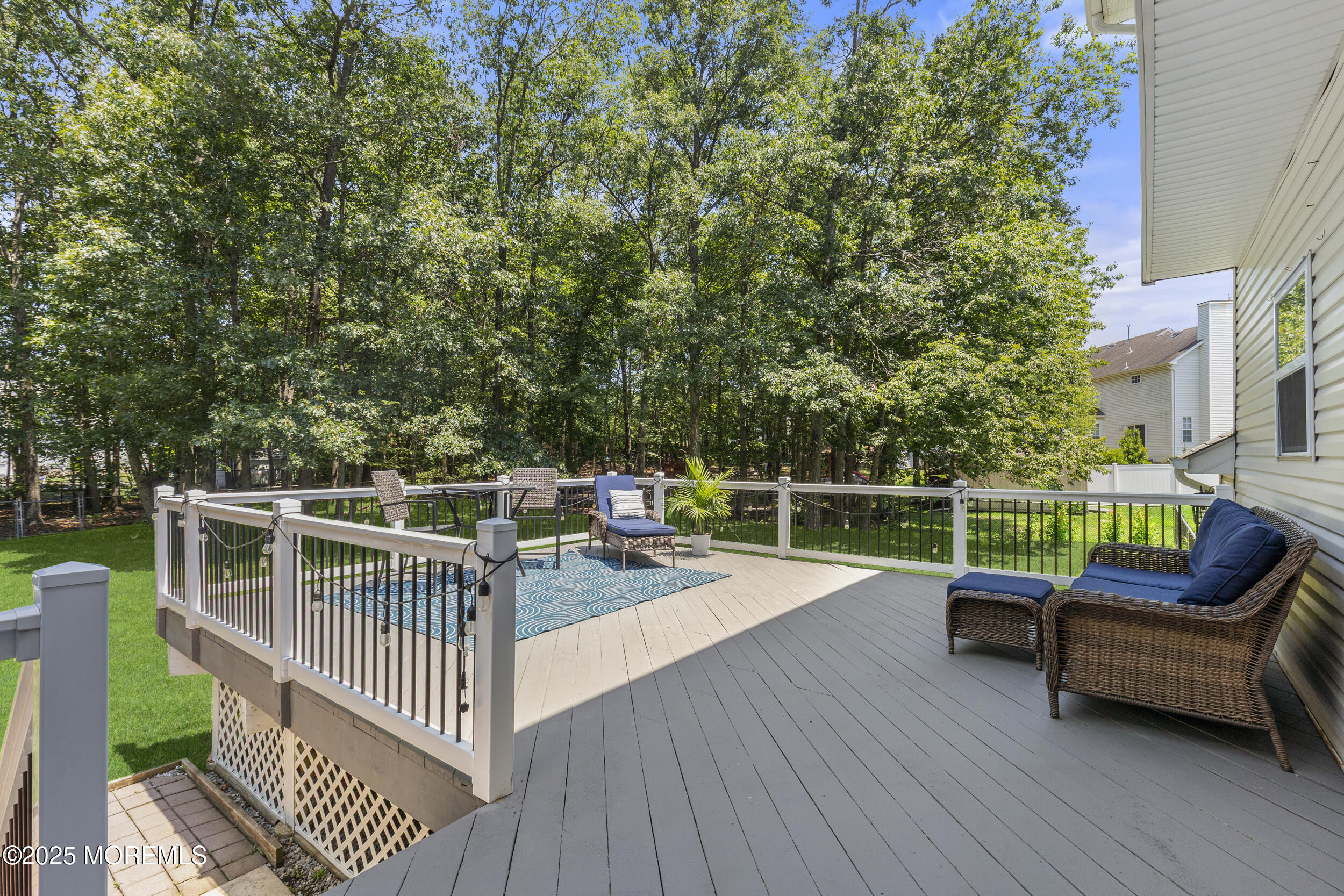 6 Kindling Way Jackson, NJ 08527 - Photo 38 of 54 a view of a chair and table on the wooden floor