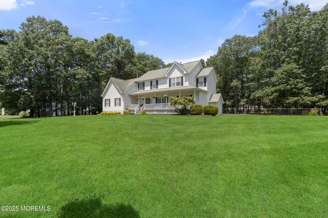 a view of a house with a big yard