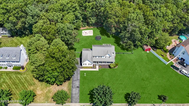 view of a city with lush green forest