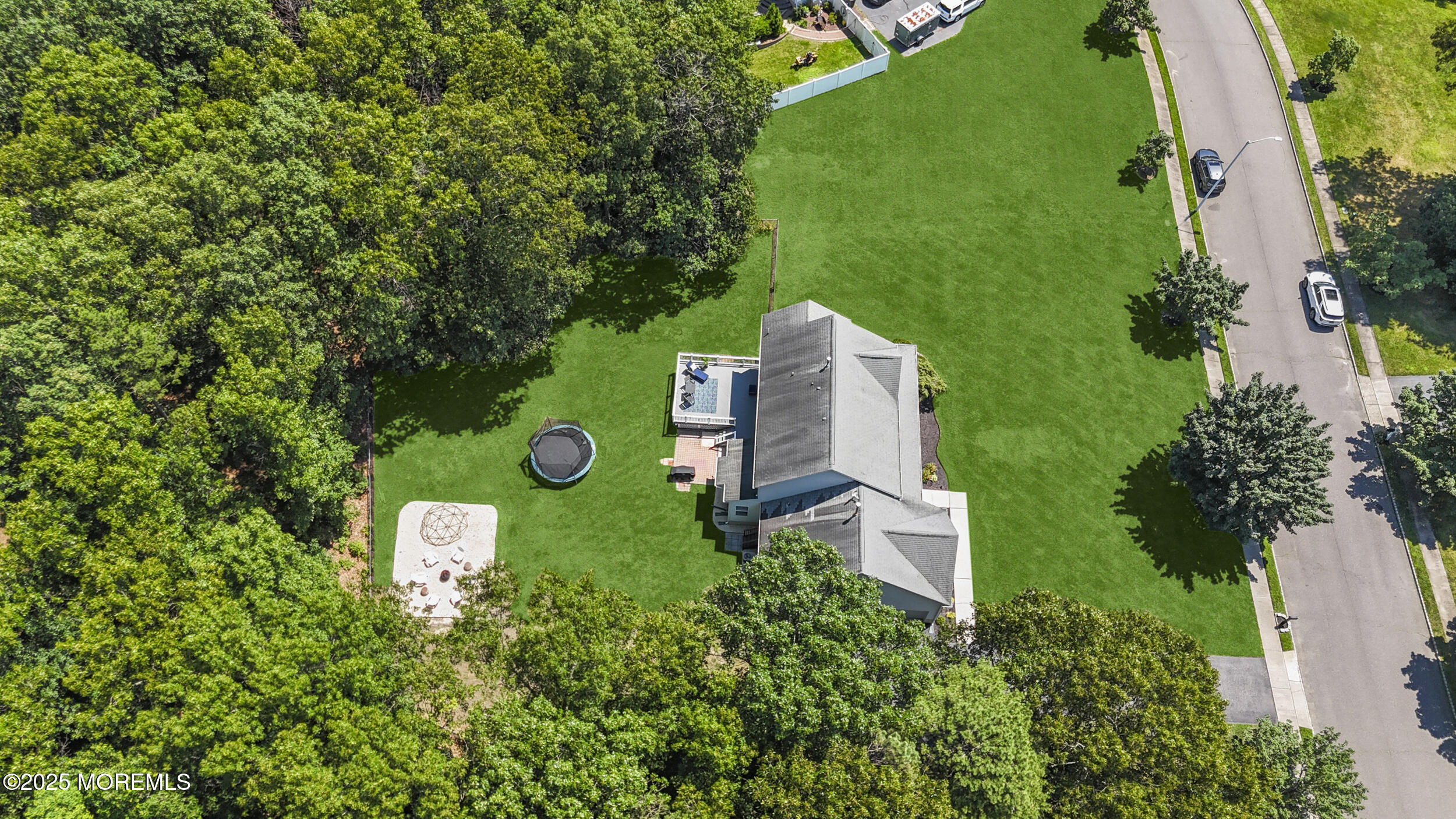 6 Kindling Way Jackson, NJ 08527 - Photo 47 of 54 an aerial view of a house with a yard and trees all around