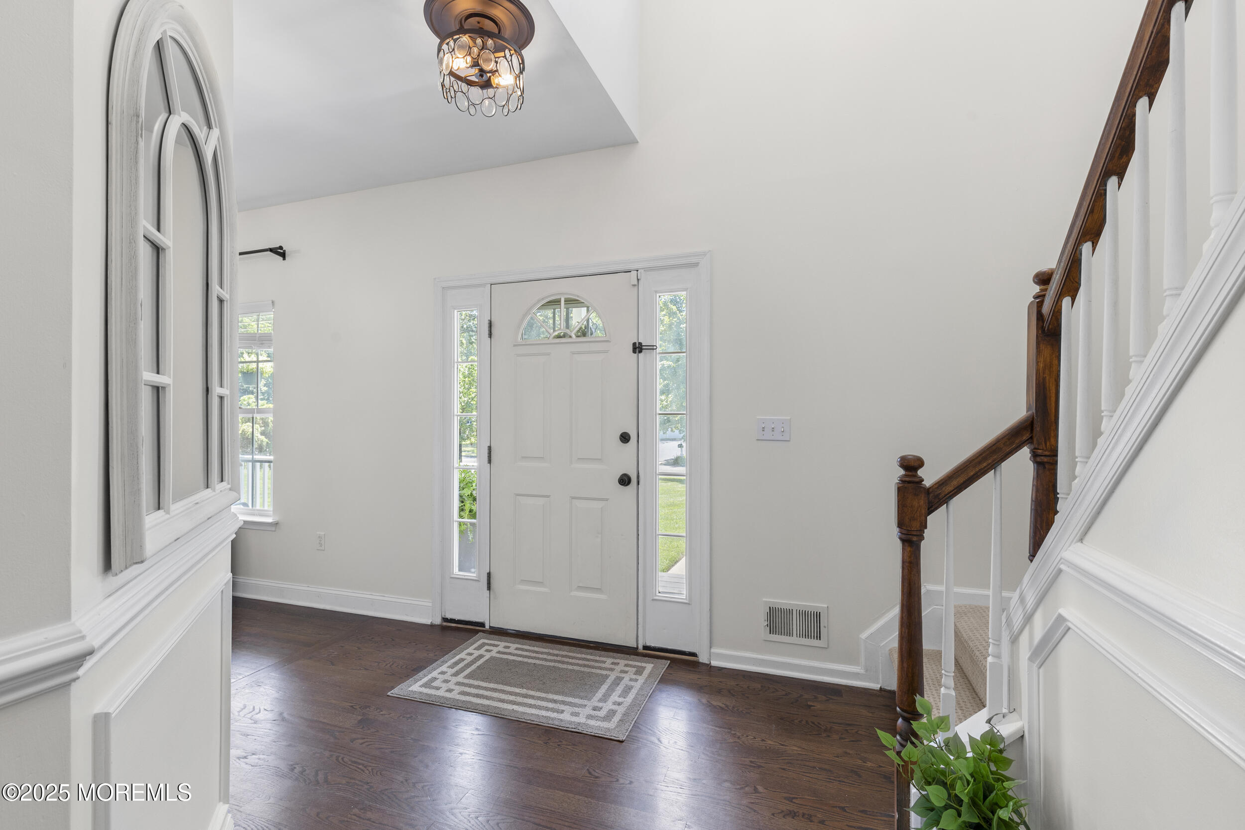 6 Kindling Way Jackson, NJ 08527 - Photo 8 of 54 a view of a hallway with wooden floor and stairs