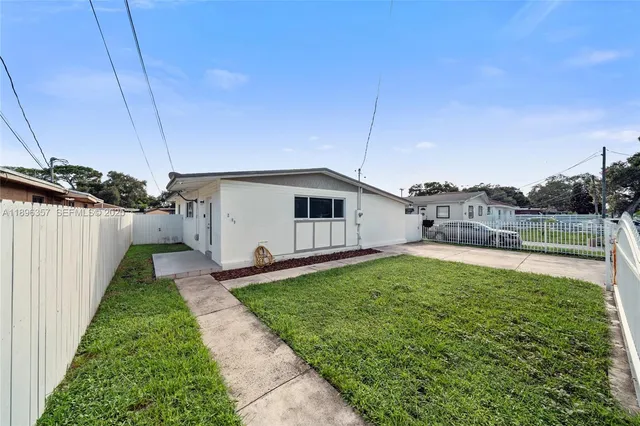 a house view with a backyard space