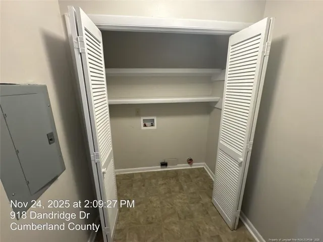 a view of an empty room with a ceiling fan