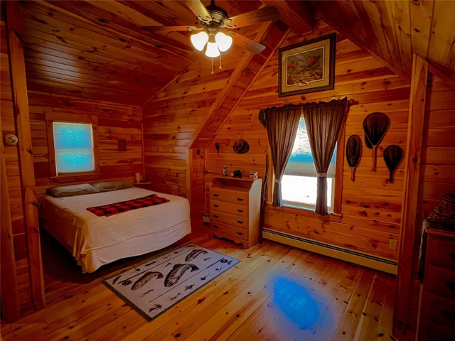 a bedroom with bed and a window