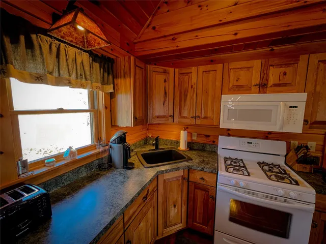 a kitchen with a stove and a microwave