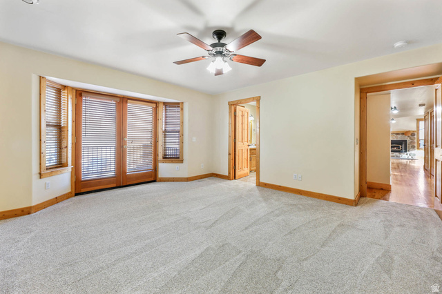 605 North Loafer Canyon Road Elk Ridge, UT 84651 - Photo 8 of 53 Primary bedroom with french doors leading to large deck