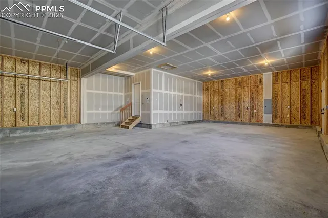 a view of empty room with wooden walls