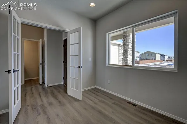 wooden floor and windows in an empty room