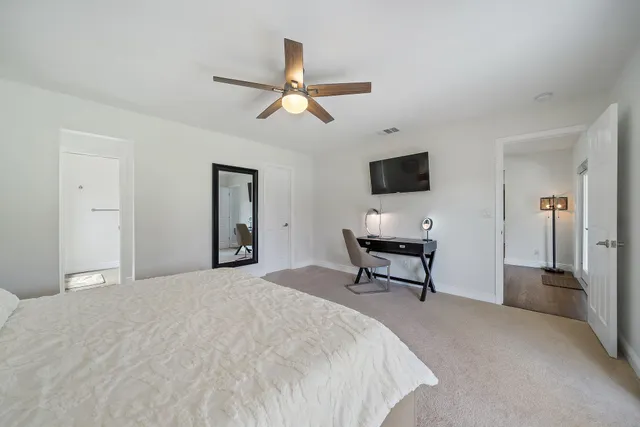 a view of a livingroom with furniture and a flat screen tv