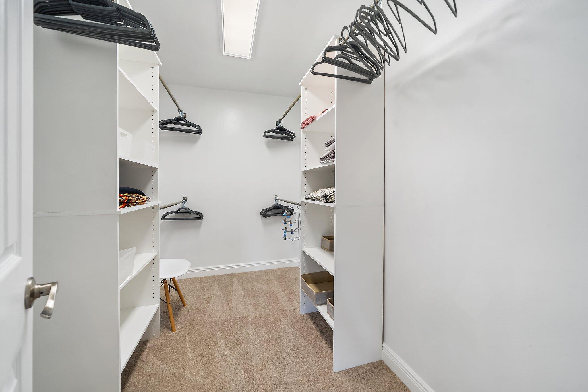 1342 Essex Drive Wellington, FL 33414 - Photo 14 of 58 a view of walk in closet with clothes and shoes