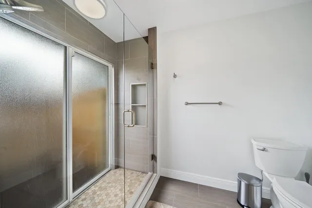 a bathroom with a tub and shower