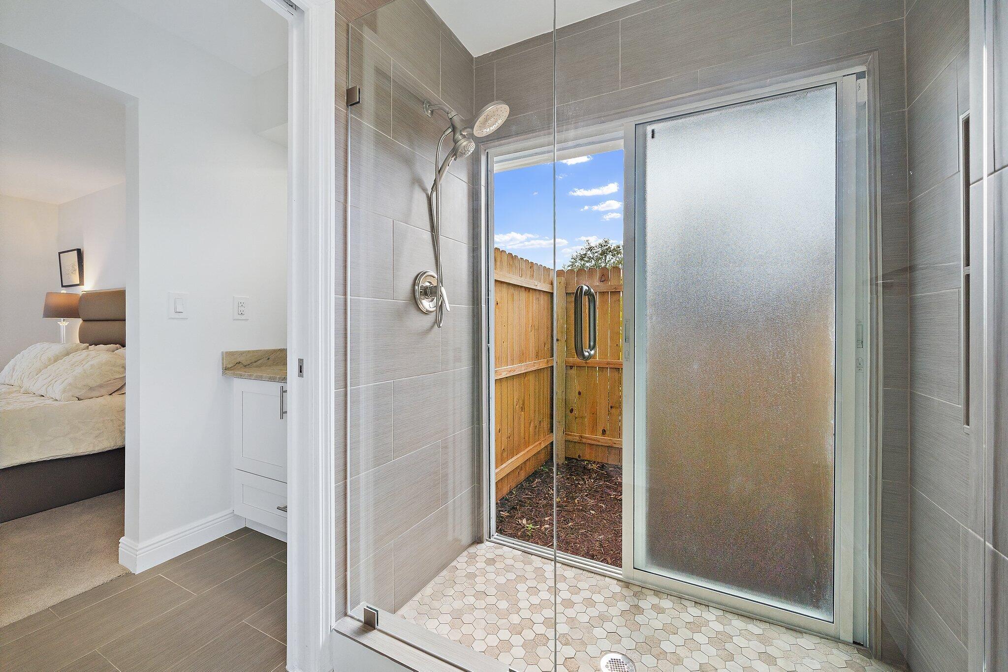 1342 Essex Drive Wellington, FL 33414 - Photo 19 of 58 a bathroom with a tub and shower