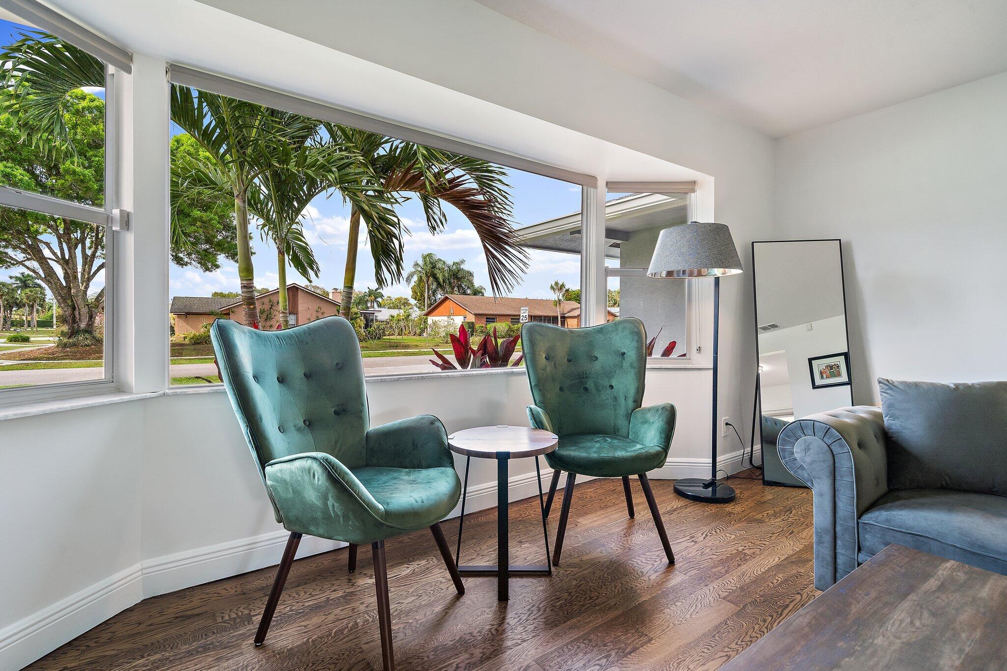 1342 Essex Drive Wellington, FL 33414 - Photo 22 of 58 a living room with furniture and a window