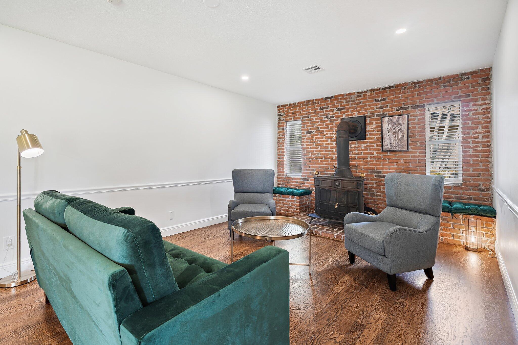 1342 Essex Drive Wellington, FL 33414 - Photo 30 of 58 a living room with furniture and a wooden floor
