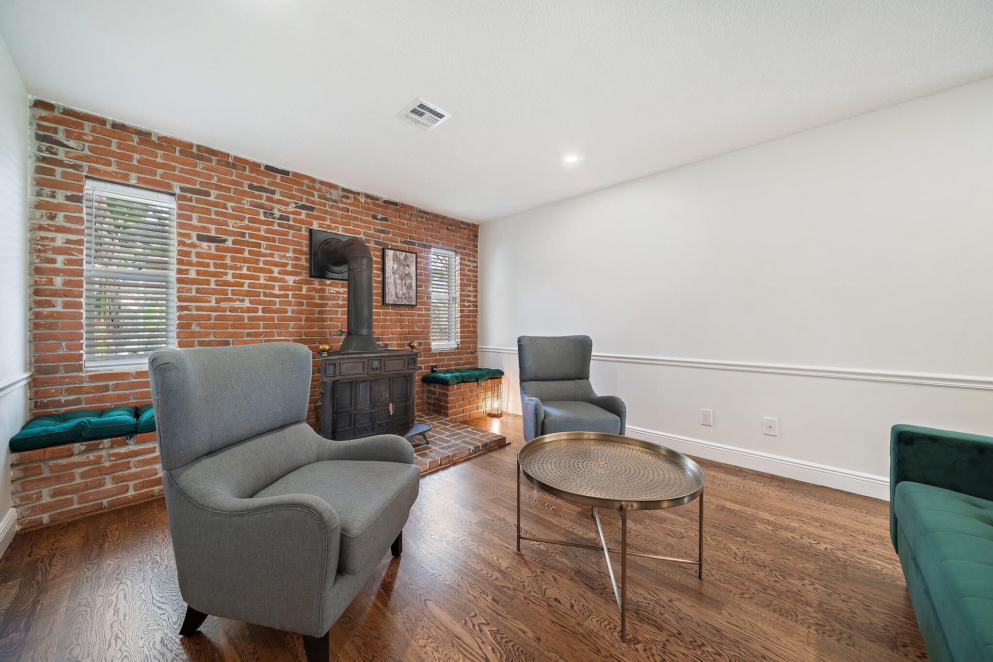 1342 Essex Drive Wellington, FL 33414 - Photo 32 of 58 a balcony with furniture and wooden floor