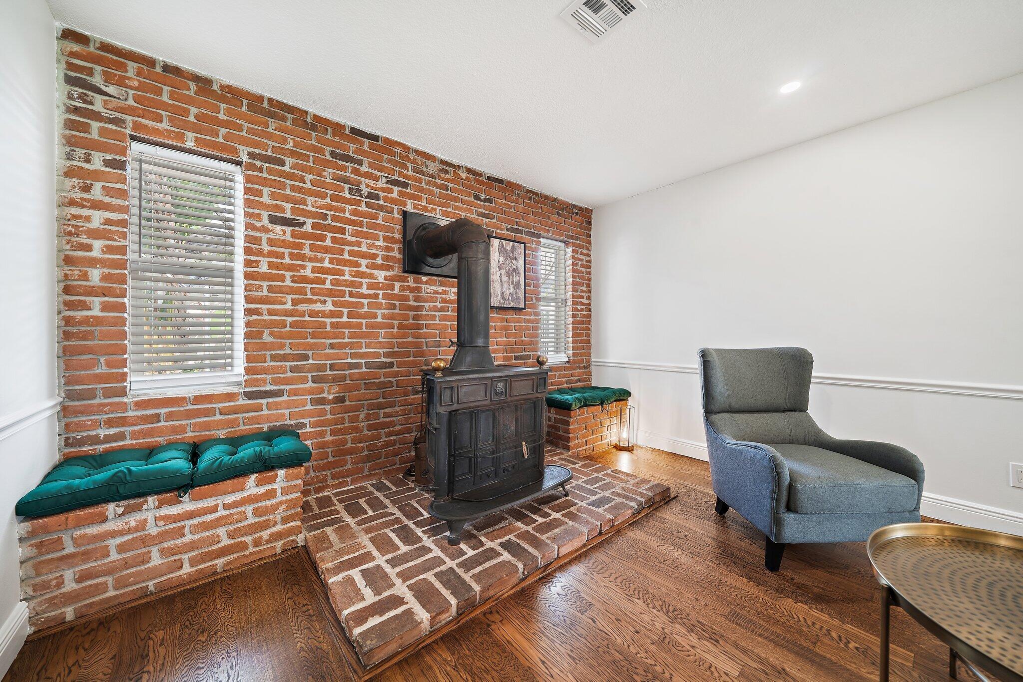 1342 Essex Drive Wellington, FL 33414 - Photo 33 of 58 a living room with furniture and a potted plant