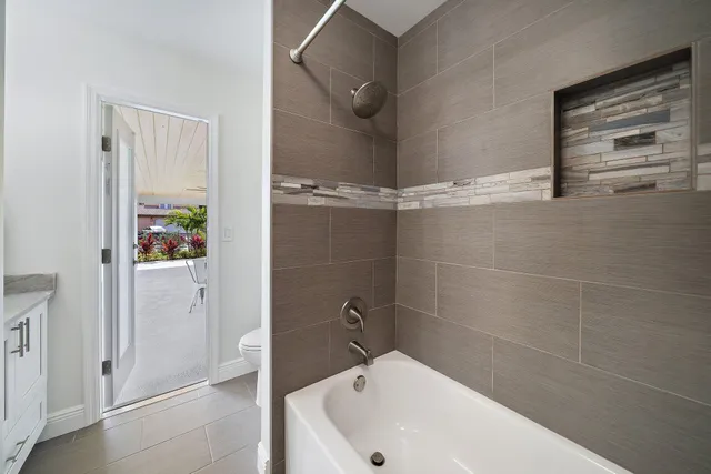 a view of a bedroom with furniture and wooden floor