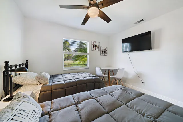 a building outdoor space with patio furniture and potted plants