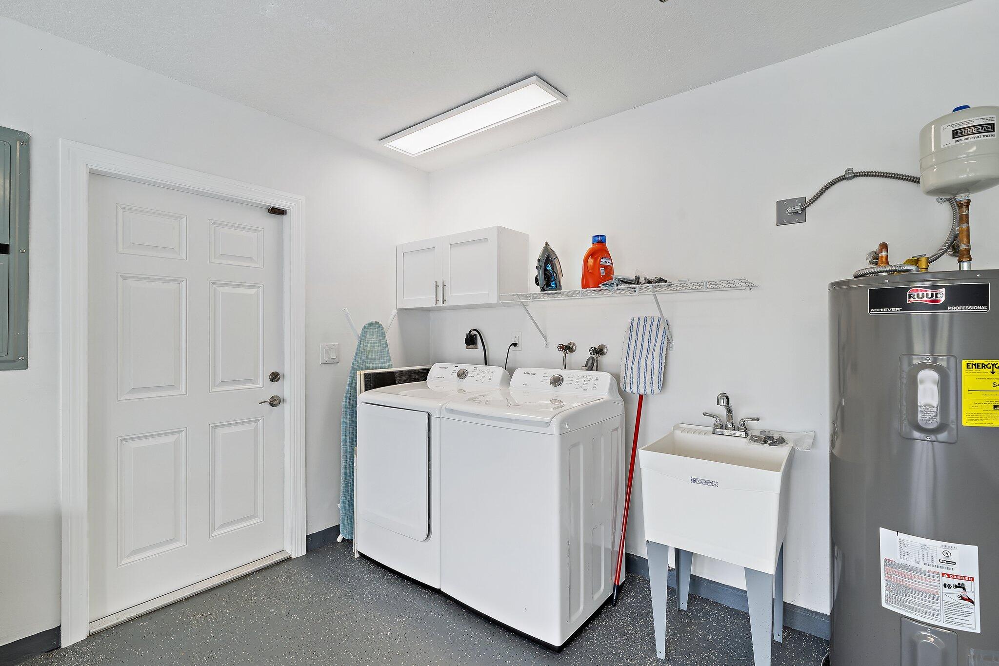 1342 Essex Drive Wellington, FL 33414 - Photo 45 of 58 a utility room with dryer and washer
