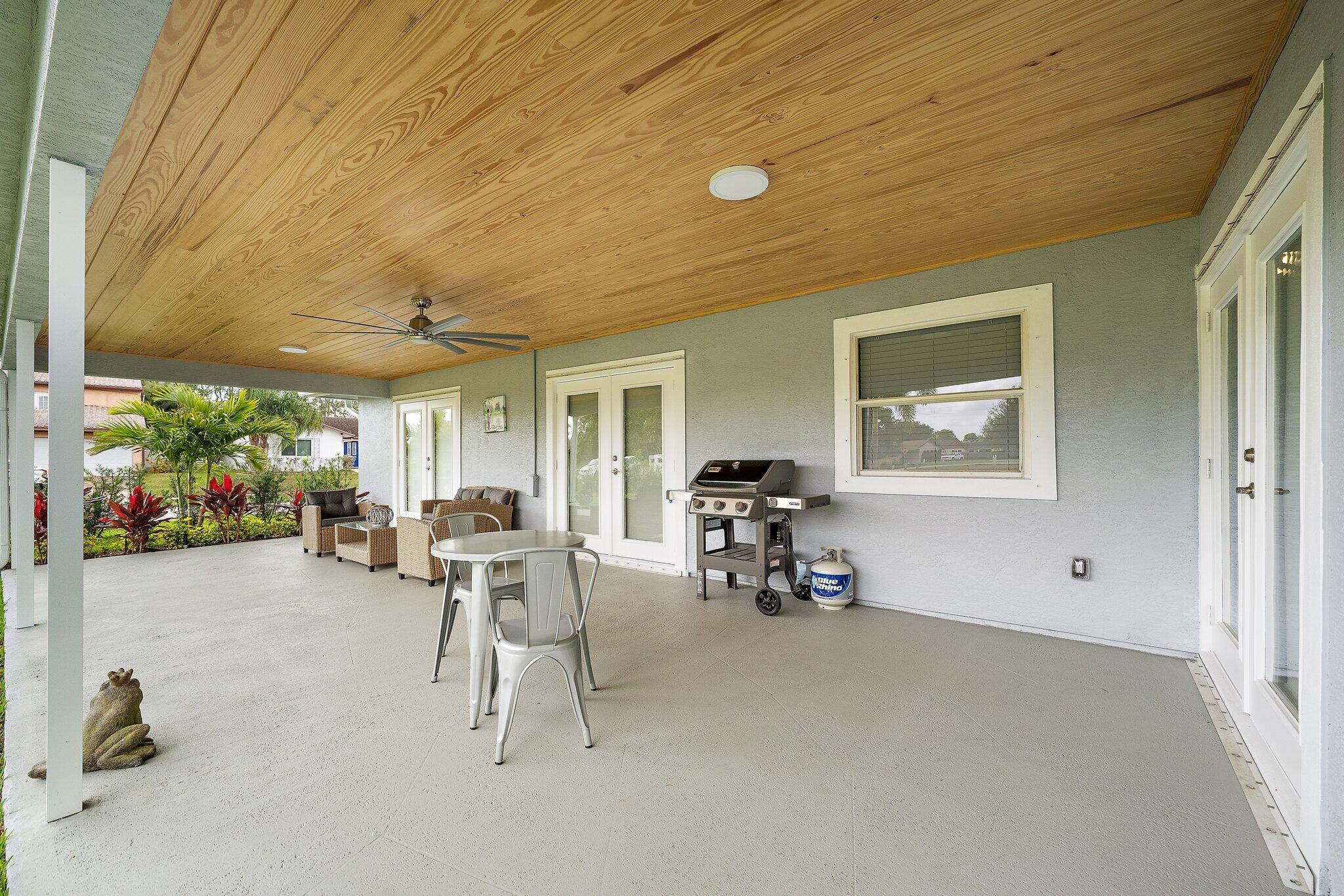 1342 Essex Drive Wellington, FL 33414 - Photo 53 of 58 a view of a dining room with furniture window and outside view