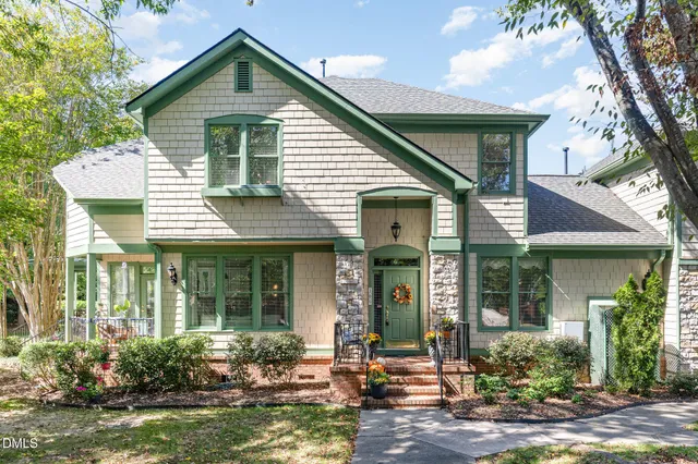 a front view of a house with a yard and porch